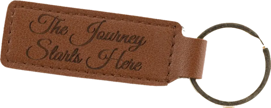 Leatherette keychain engraved with The Journey Starts Here
